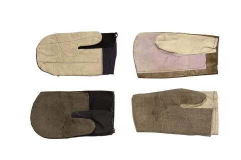 Four kinds of work gauntlets. one finger gloves for welders (leather top) a.. Stock Photos