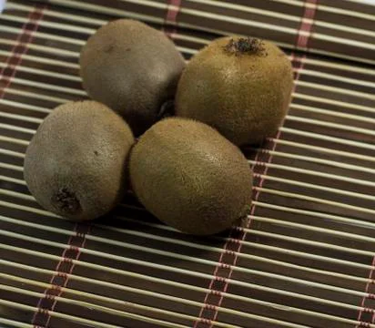 Four kiwis close up Stock Photos