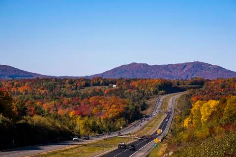  Four lane highway with cars and trucks in autumn Stock Photos