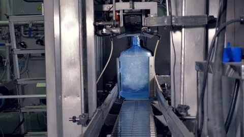 Four large size water bottles filled out. Stock Footage