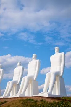 Four large white statues known as "Men at Sea." Stock Photos