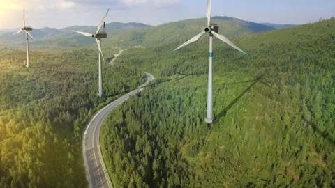 Four large wind turbines on a sunny day with mountain views. Beauty 3D rendering Stock Footage 236848212