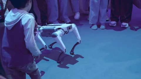 Four-Legged Robot dog - mechanical device with AI, behavior of a living creature Stock Footage 323852107