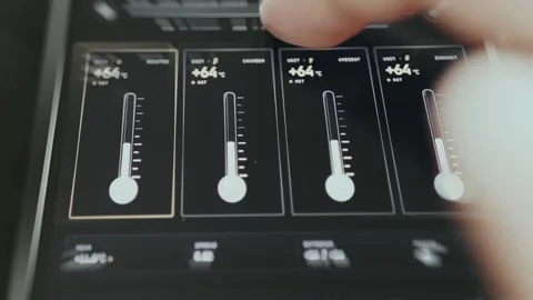 Four linear gauges for temperature tracking, user drags the slider leading to Stock Footage 335469796