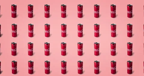Four lines of tin coca cola cans animated on a pink background Stock Footage 135733001