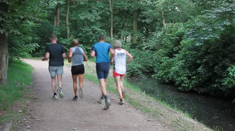Four men jogging in the park Vidéo 30362587