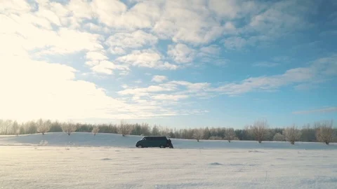 Four men push van without gas in sunny winter day Stock Footage 83267992