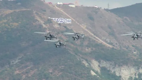 Four Mi-28N combat helicopter night hunter (Havoc) perform group aerobatics Stock Footage 134032532