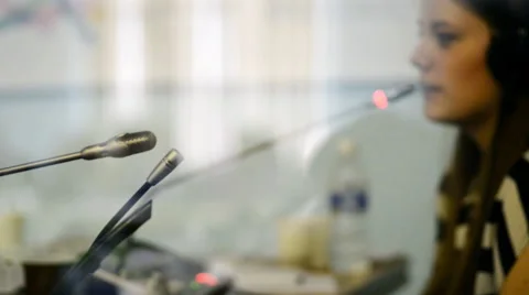 Four microphones record everything that broadcasts a leading woman talking to Stock Footage 57807815