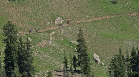 Four mountain bikers wind through a rocky trail in Idaho Stock Footage 36307847