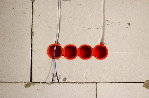 Four mounting boxes for the outlet. Installation of new sockets Stock Photos