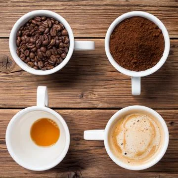 Four mugs of coffee Stock Photos
