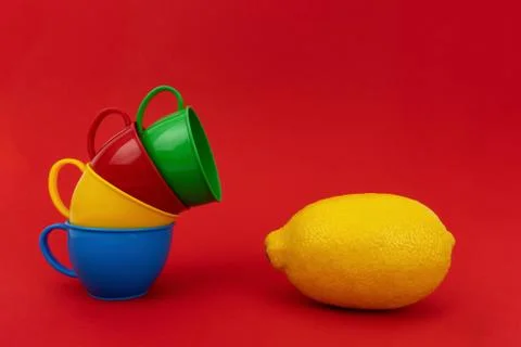 Four mugs on red background. Stock Photos