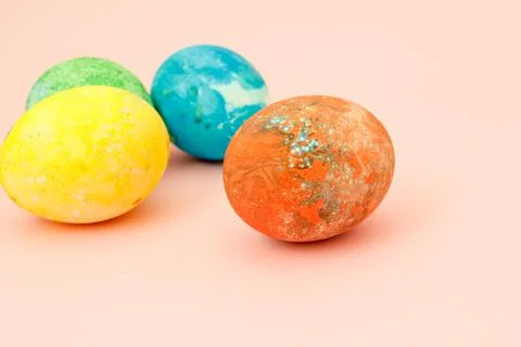 Four multi-colored Easter eggs top view, space for text. Concept happy easter Foto stock