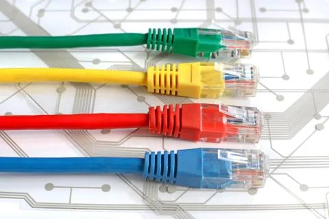 Four Multi Colored Network Cables on Circuit Board Stock Photos
