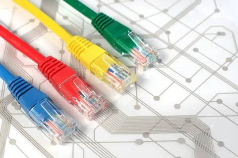 Four Multi Colored Network Cables on Circuit Board Stock Photos