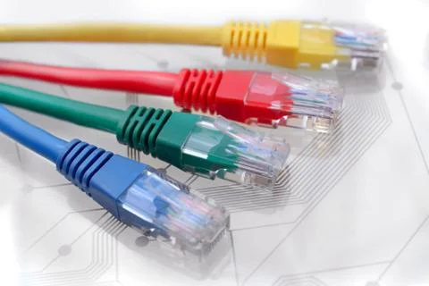 Four Multi Colored Network Cables on Circuit Board Stock Photos