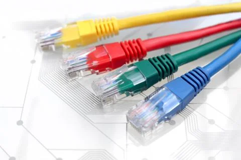 Four Multi Colored Network Cables on Circuit Board Stock Photos