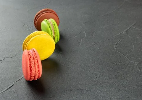 Four multicolored macaroons Stock Photos