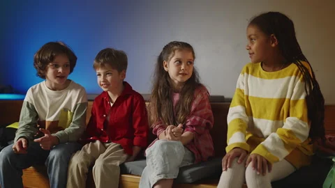Four multiracial classmates talking and laughing during school break time Stock Footage 333587146