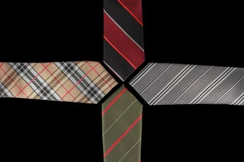 Four neckties with their ends facing each other Stock Photos