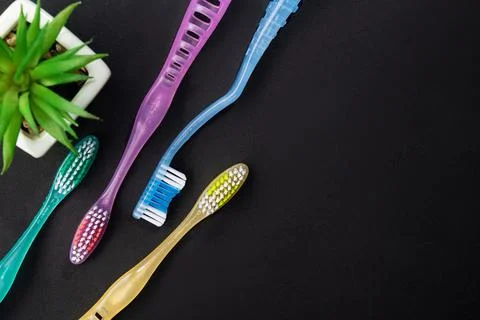 Four new toothbrushes Stock Photos