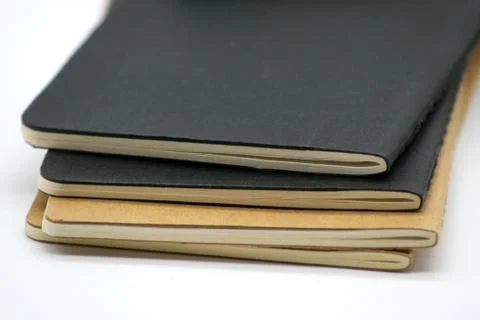 Four Notebooks over white background Stock Photos