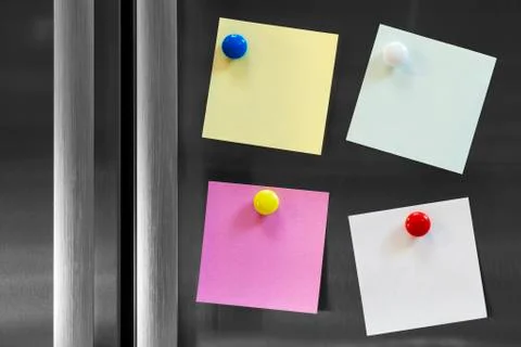 Four notes attached to fridge Stock Photos