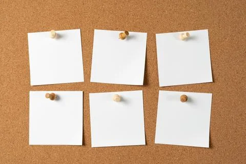 Four Notes Pinned on Cork Board with Wooden Push Pins Stock Photos
