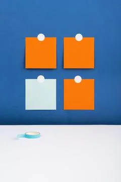 Four Notes Sticked On Wall With Important Messages Above Desk With Tape. Crutial Stock Photos