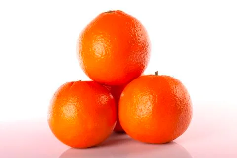 Four oranges stacked isolated Stock Photos