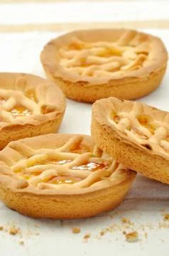 Four peach tarts Stock Photos