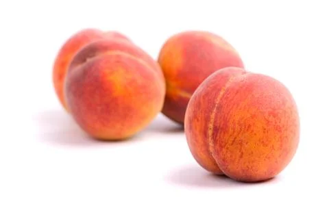 Four peaches Stock Photos
