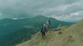 The four people with backpacks standing on the beautiful mountain 4k or 4k+ Resolution
