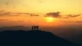 The four people dancing on a mountain against the picturesque sunrise 4k or 4k+ Resolution
