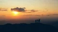 The four people dancing on a mountain against the picturesque sunset 4k or 4k+ Resolution