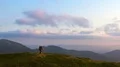 The four people dancing on the mountain with a beautiful landscape 4k or 4k+ Resolution