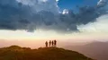 The four people dancing on the mountain with the beautiful landscape 4k or 4k+ Resolution