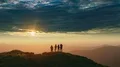 The four people dancing on the mountain with a beautiful sunset 4k or 4k+ Resolution