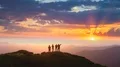 The four people dancing on a mountain with a beautiful sunset 4k or 4k+ Resolution