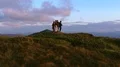 The four people dancing on the mountain with the beautiful landscape 4k or 4k+ Resolution