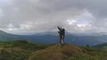 The four people dancing on the mountain with a picturesque landscape 4k or 4k+ Resolution
