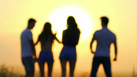 The four people dancing on the sunlight background. slow motion Stock Footage 134832967