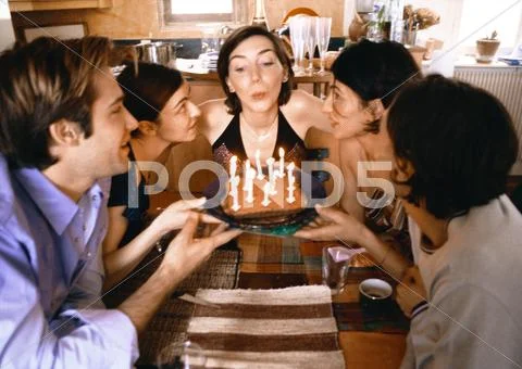 Four People Holding Cake, Woman Blowing Out Candles