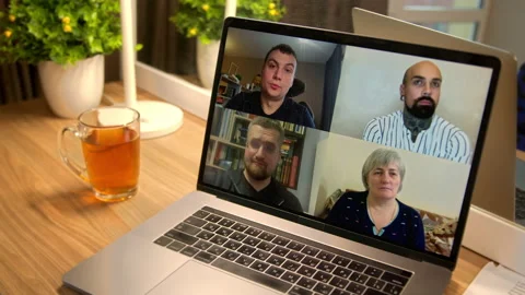 Four people on a laptop screen make a video call 4K Slow-motion Video stock 148394557