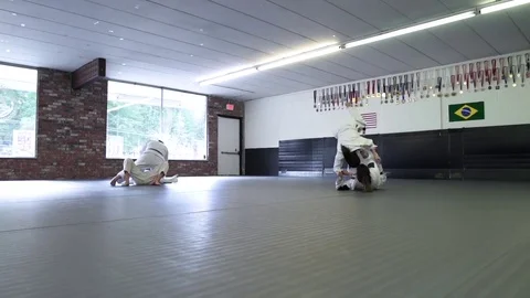 Four people practicing Jiu-jitsu Stock-Footage 77080437
