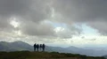 The four people standing on the beautiful mountain 4k or 4k+ Resolution