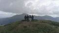 The four people standing on the beautiful mountain 4k or 4k+ Resolution