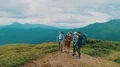 The four people standing on the beautiful mountain 4k or 4k+ Resolution