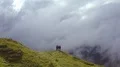 The four people standing on a cliff of a mountain with the beautiful cloud view 4k or 4k+ Resolution